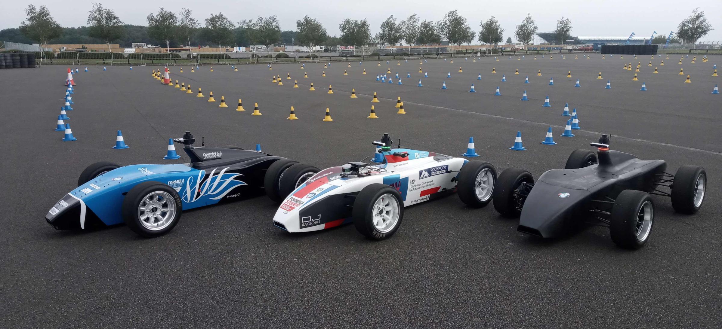 Three racing cars on a track